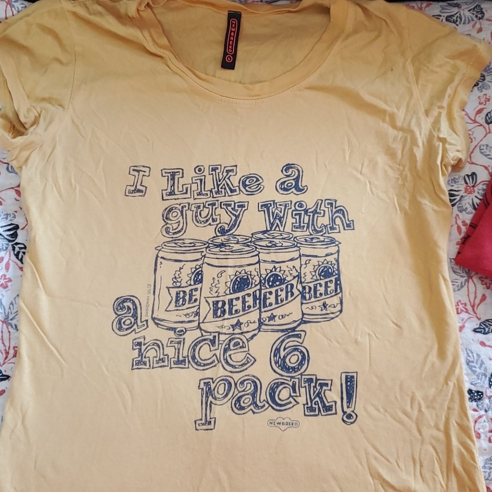 Fitted ladies tee. I like a guy with a nice 6 pack